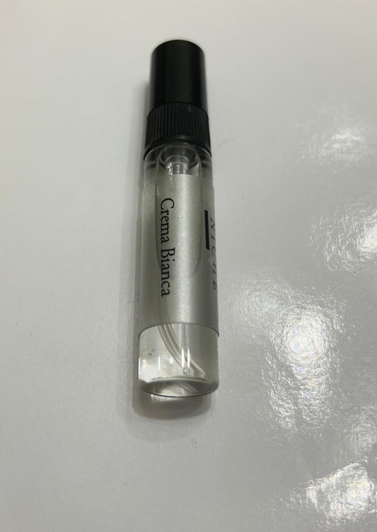 Small clear bottle with black cap labeled 'Crema Bianca' on a white background